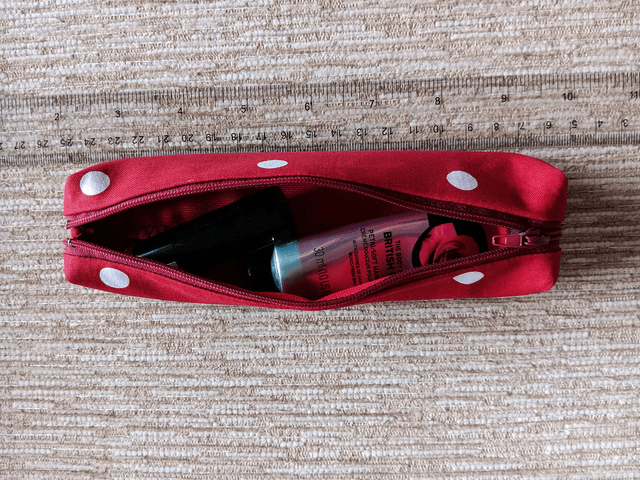 Small Box Shaped Cosmetic Bag Red background with white spots, Red Waterproof Lining, and Red Zip.