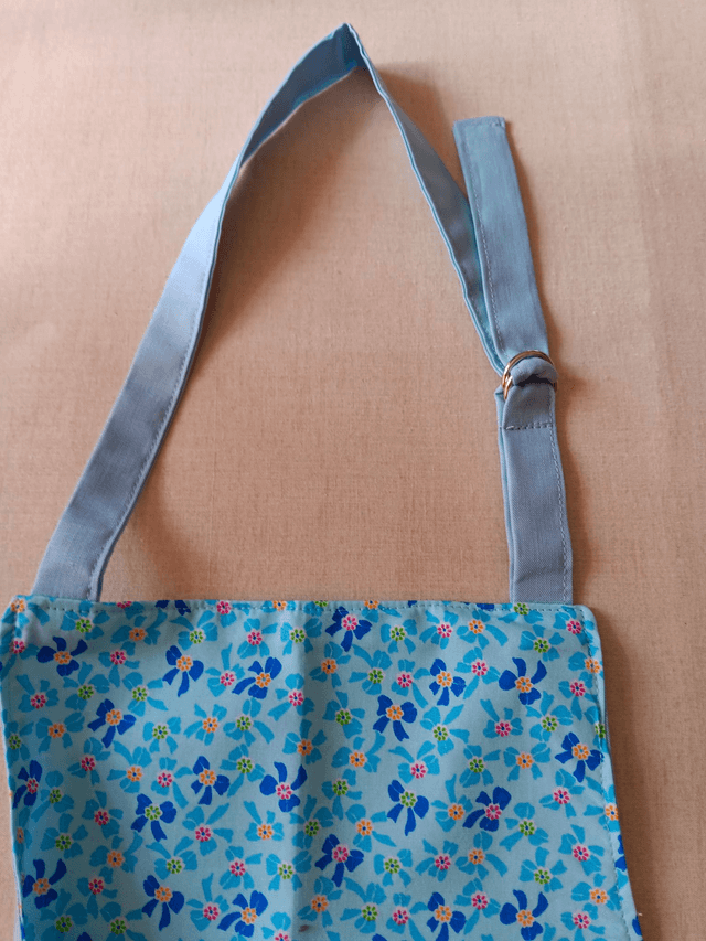 Childs Kitchen/Play Apron  Blue Bows Cotton Fabric with Front pocket and pale blue lining, waist ties and adjustable neck tie