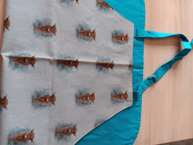 Adult Kitchen Apron Highland Cows(Coos) Patterned Cotton Fabric with Front pocket and turquoise lining, waist ties and adjustible neck ties