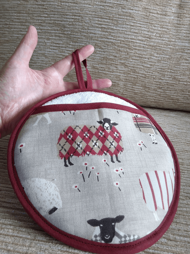 Round Hot Pot Grab Mat in Baa Baa Peony Fabric heat resistant wadding filling and hanging loop