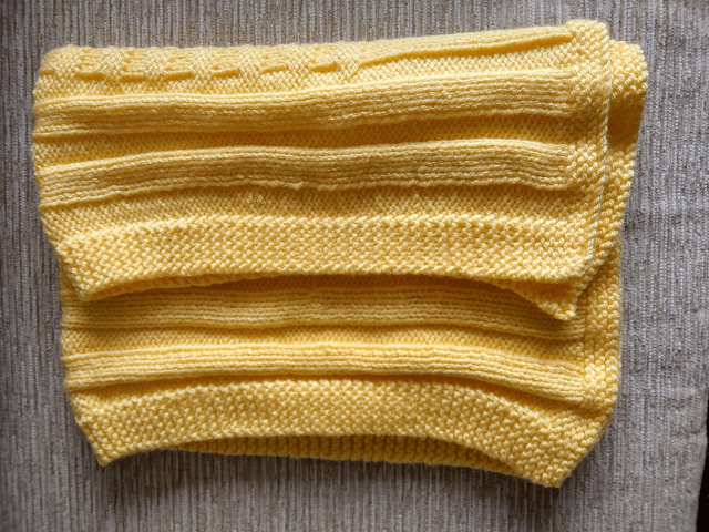 Hand Knitted Blanket in Lemon Baby soft Chunky yarn with basket weave and rib pattern