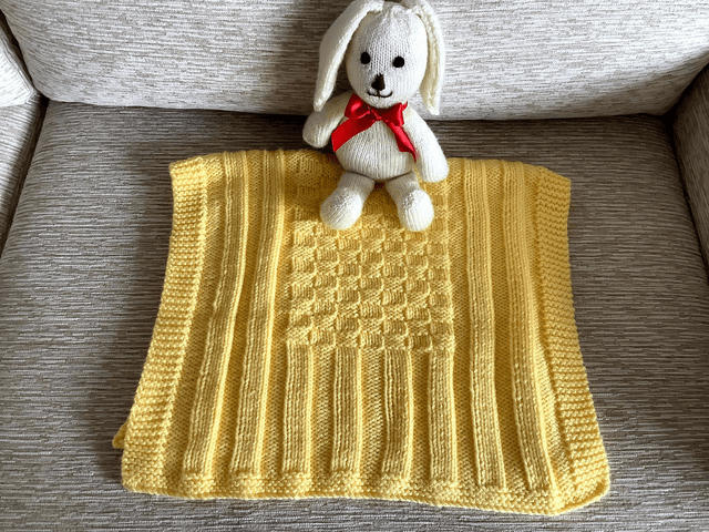 Hand Knitted Blanket in Lemon Baby soft Chunky yarn with basket weave and rib pattern