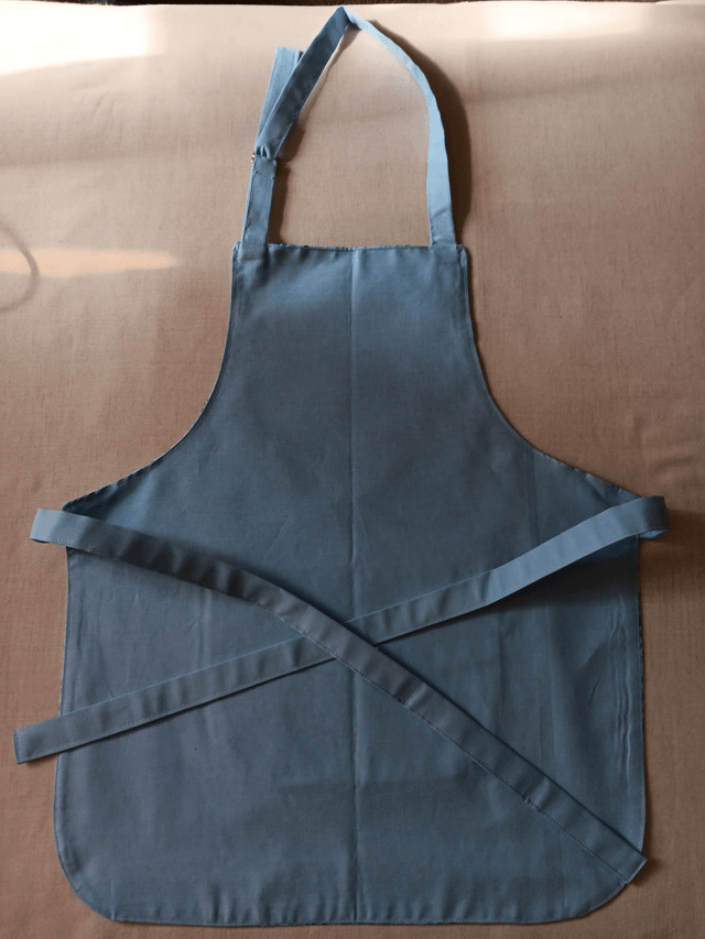 Childs Kitchen/Play Apron  Blue Bows Cotton Fabric with Front pocket and pale blue lining, waist ties and adjustable neck tie