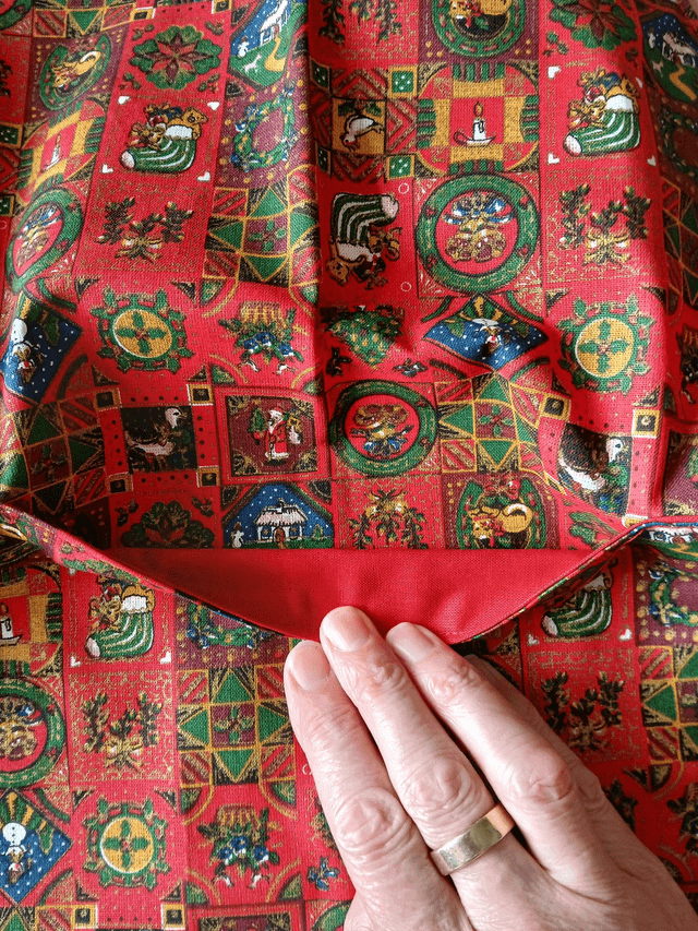 Childs Kitchen Play Apron Festive Patterned Cotton Fabric with Front pocket and Red lining, waist ties and adjustable neck ties