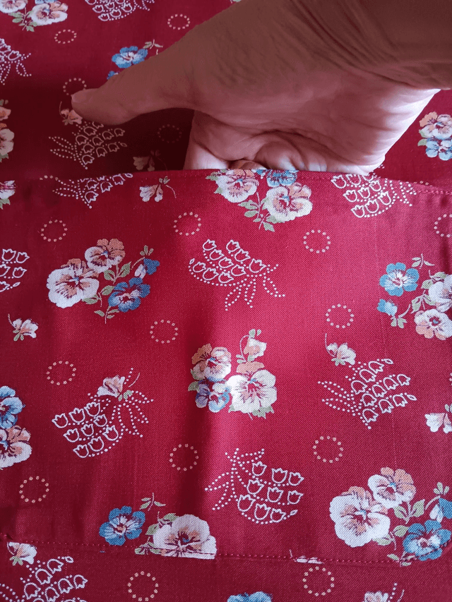 Childs Kitchen Play Apron Burgundy Flower Patterned Cotton Fabric with Front pocket and Burgundy lining, waist ties and adjustable neck ties 