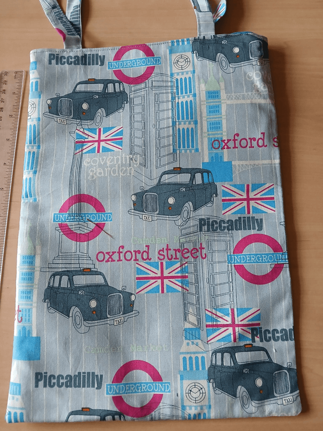 Fully lined Children's Tote/Toy bag Vehicle Print Cotton Fabric with synthetic fabric lining.