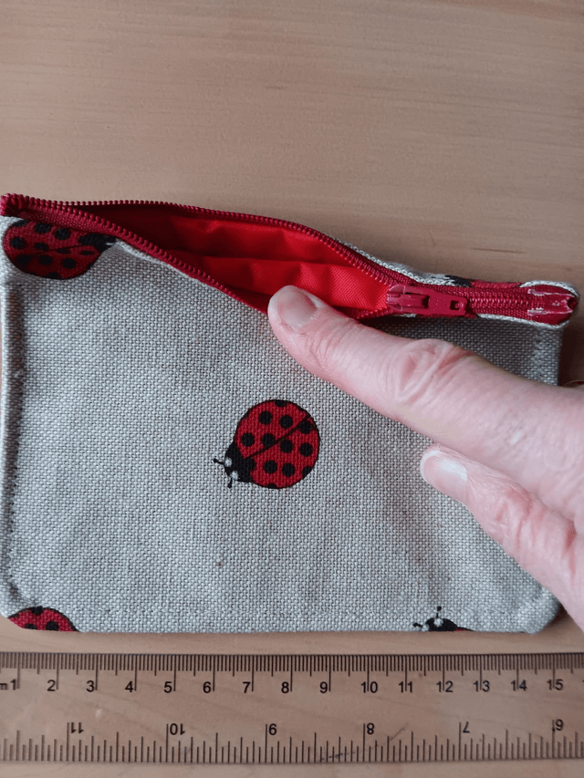 Beige Fabric Purse with ladybirds and Red Waterproof Lining and red Zip