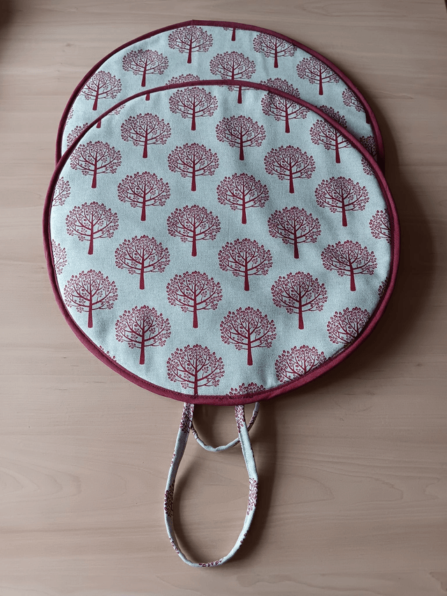 Pair of Beige Aga Lid Covers with Red Mulberry Trees Print Fabric and Burgundy binding