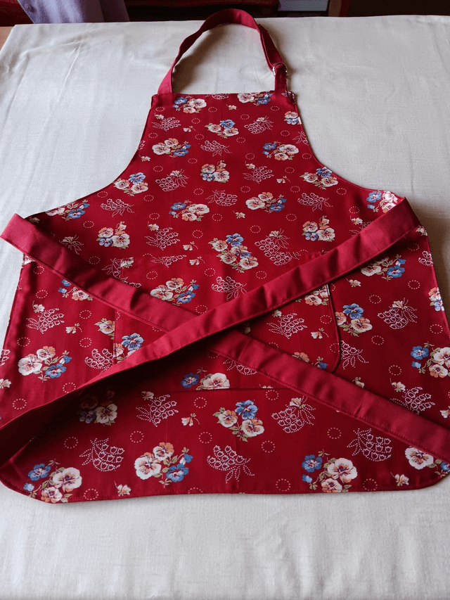Childs Kitchen Play Apron Burgundy Flower Patterned Cotton Fabric with Front pocket and Burgundy lining, waist ties and adjustable neck ties 
