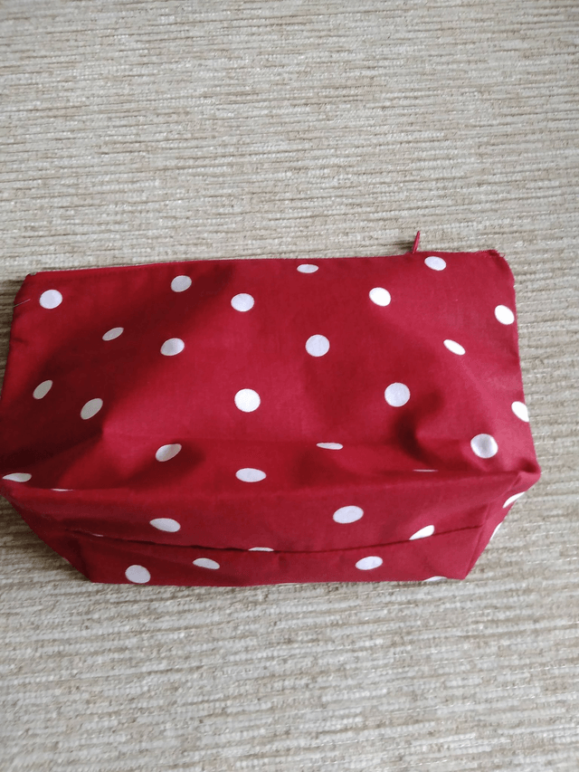Cosmetic Toiletry Wash Bag in Red with White spots cotton fabric with red PU waterproof lining and Zip Closure.