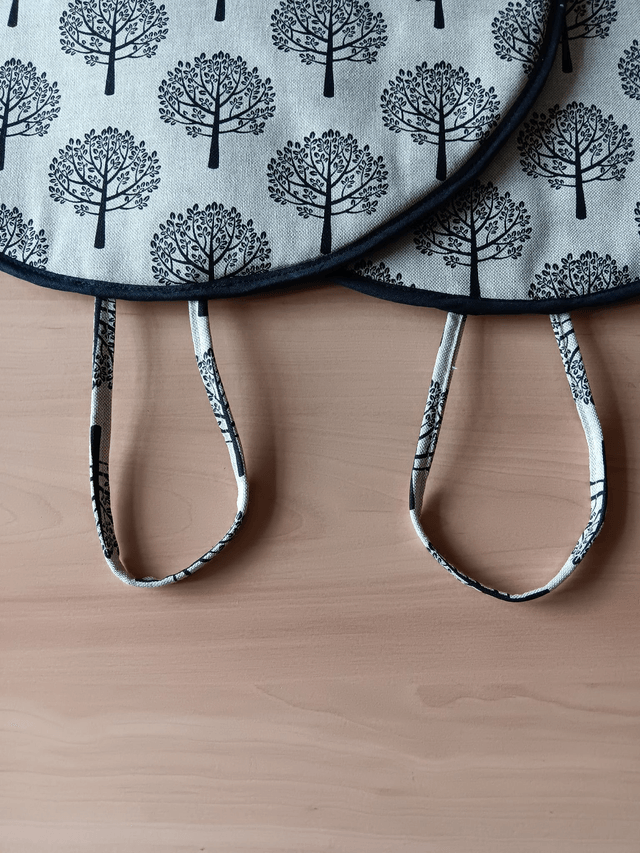 Pair of Beige Aga Lid Covers with Black Mulberry Trees Print Fabric and Black binding