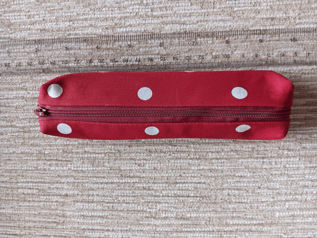 Small Box Shaped Cosmetic Bag Red background with white spots, Red Waterproof Lining, and Red Zip.