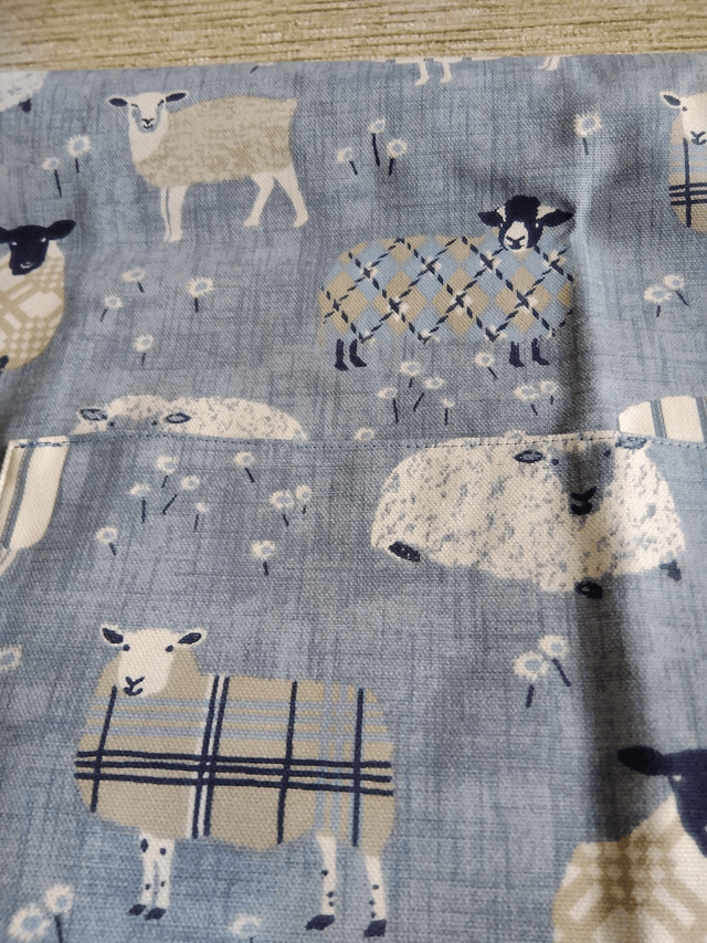 Adult Kitchen Apron Baa Baa Denim Sheep Patterned Cotton Fabric with Front pocket and Blue lining, waist ties and adjustible neck ties