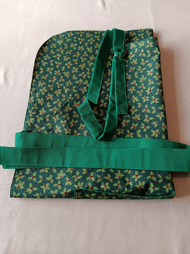 Kitchen Apron Cotton Holly Print Fabric with Green Lining and straps. Adjustable neck tie, lined matching pocket