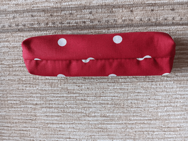 Small Box Shaped Cosmetic Bag Red background with white spots, Red Waterproof Lining, and Red Zip.