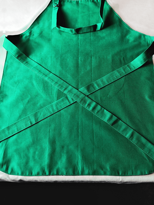 Kitchen Apron Cotton Holly Print Fabric with Green Lining and straps. Adjustable neck tie, lined matching pocket