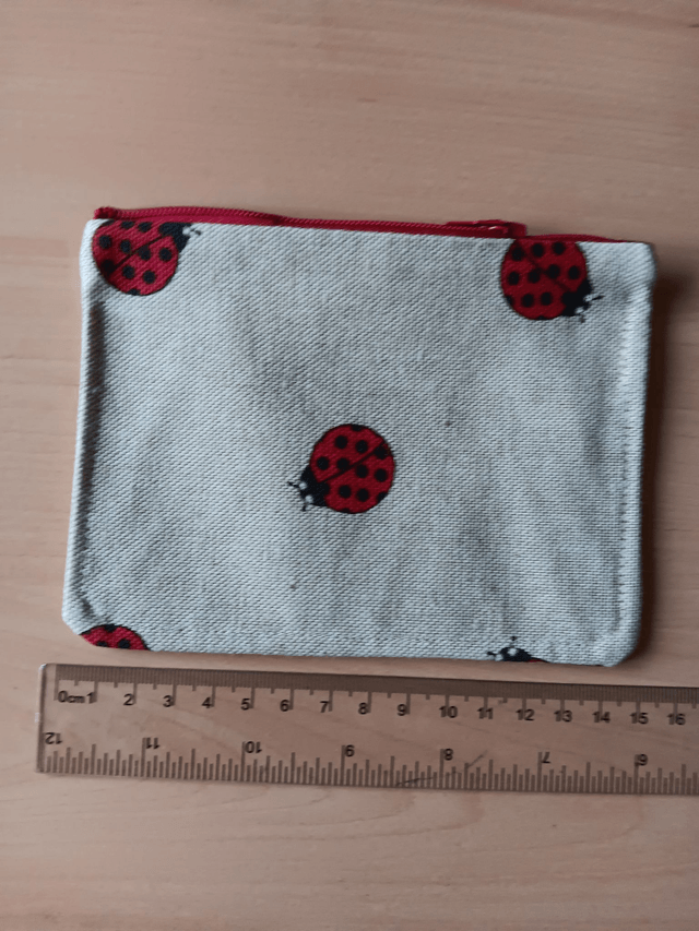 Beige Fabric Purse with ladybirds and Red Waterproof Lining and red Zip