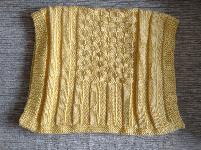 Hand Knitted Blanket in Lemon Baby soft Chunky yarn with basket weave and rib pattern