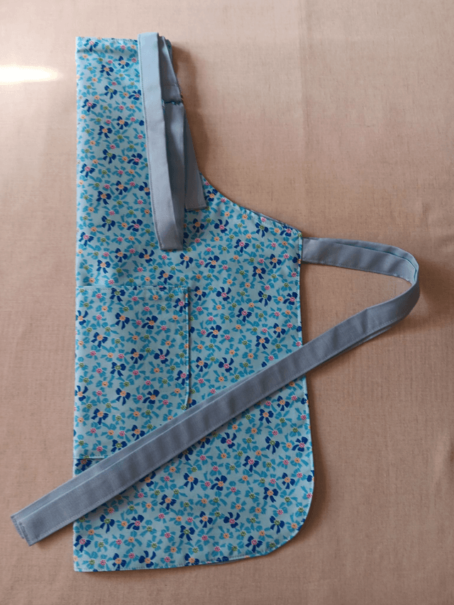 Childs Kitchen/Play Apron  Blue Bows Cotton Fabric with Front pocket and pale blue lining, waist ties and adjustable neck tie