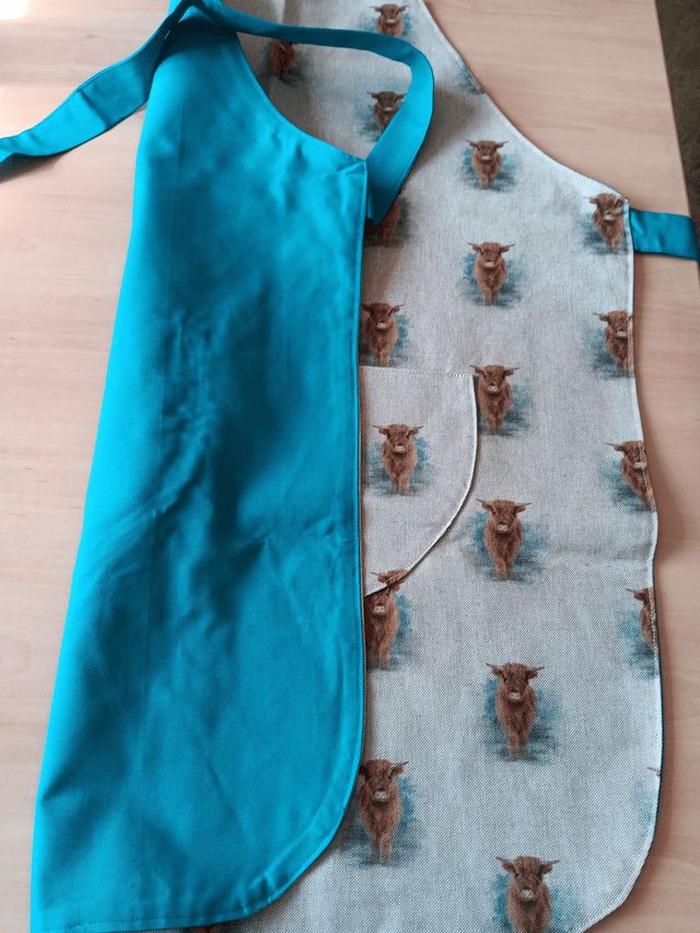 Adult Kitchen Apron Highland Cows(Coos) Patterned Cotton Fabric with Front pocket and turquoise lining, waist ties and adjustible neck ties