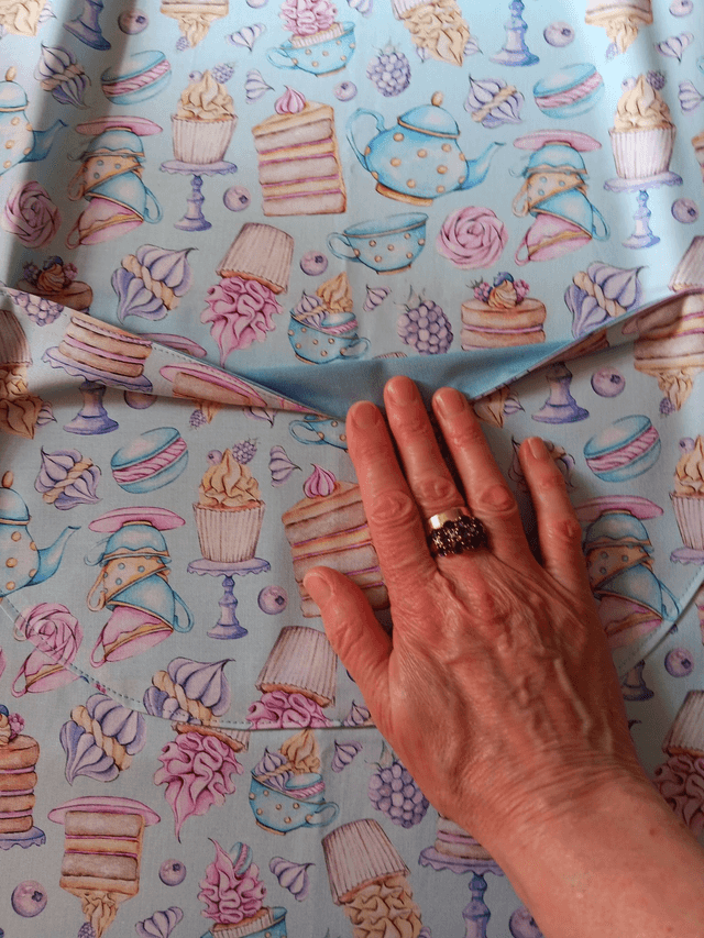 Adult Kitchen Apron Tea and Cakes Patterned Cotton Fabric with Front pocket and Pale blue lining, waist ties and adjustable neck ties