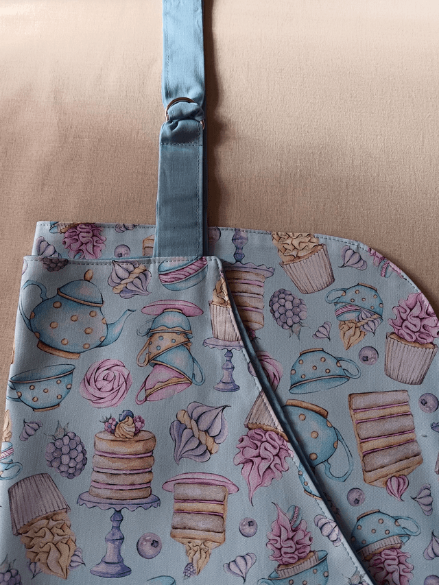 Adult Kitchen Apron Tea and Cakes Patterned Cotton Fabric with Front pocket and Pale blue lining, waist ties and adjustable neck ties