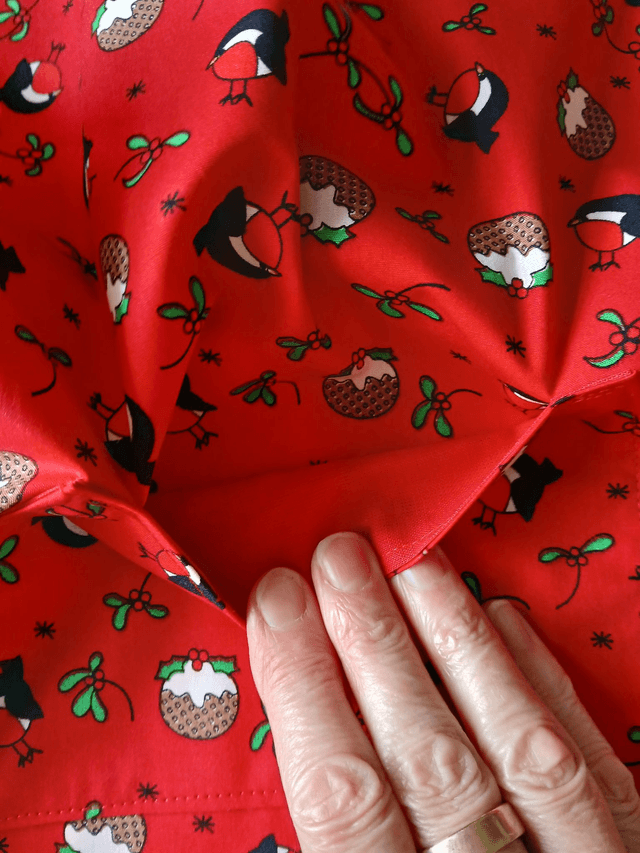 Childs Kitchen Play Apron Pudding Patterned Cotton Fabric with Front pocket and Red lining, waist ties and adjustable neck ties (1)