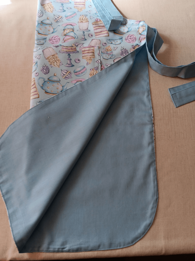 Adult Kitchen Apron Tea and Cakes Patterned Cotton Fabric with Front pocket and Pale blue lining, waist ties and adjustable neck ties
