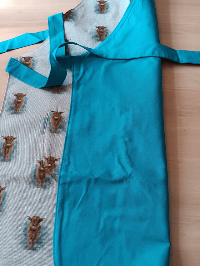 Adult Kitchen Apron Highland Cows(Coos) Patterned Cotton Fabric with Front pocket and turquoise lining, waist ties and adjustible neck ties