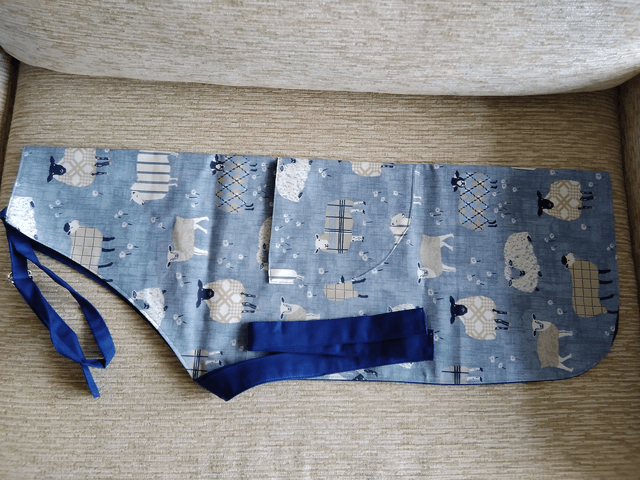 Adult Kitchen Apron Baa Baa Denim Sheep Patterned Cotton Fabric with Front pocket and Blue lining, waist ties and adjustible neck ties