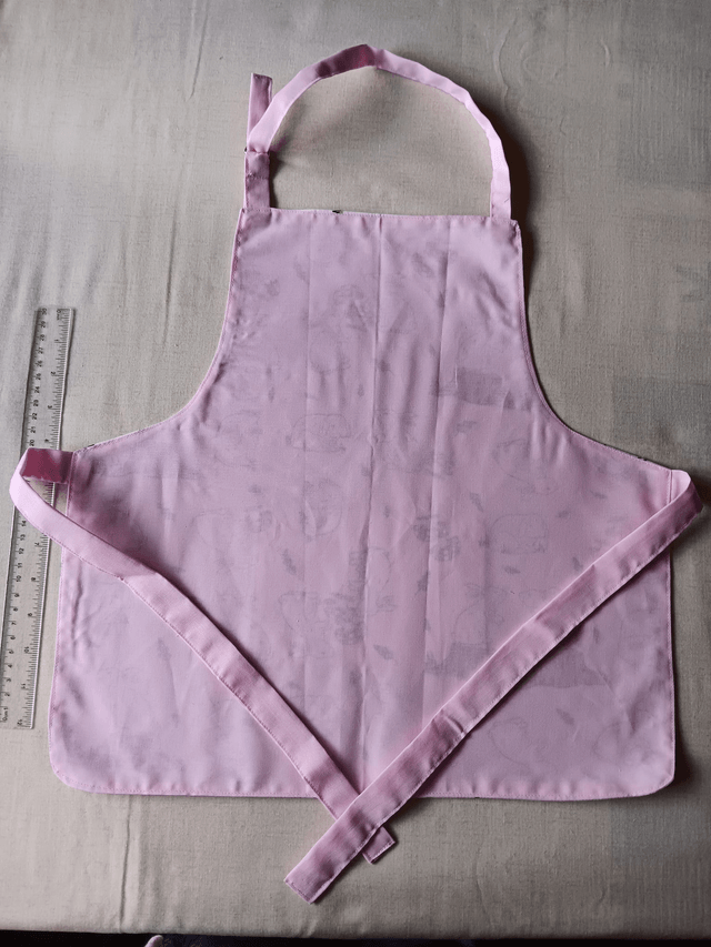 Childs Kitchen Play Apron Pink Bunnies Patterned Cotton Fabric with Front pocket and pink lining, waist ties and adjustable neck ties 
