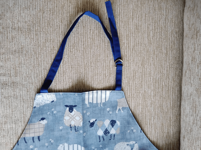 Adult Kitchen Apron Baa Baa Denim Sheep Patterned Cotton Fabric with Front pocket and Blue lining, waist ties and adjustible neck ties