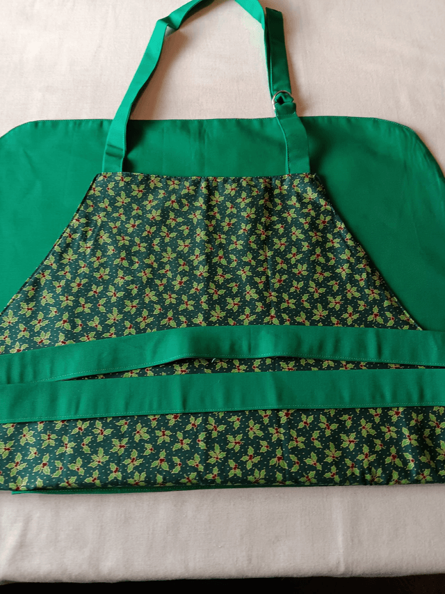 Kitchen Apron Cotton Holly Print Fabric with Green Lining and straps. Adjustable neck tie, lined matching pocket