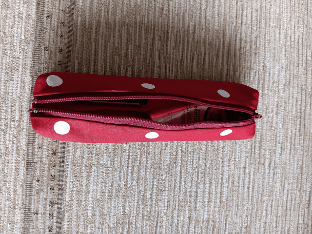 Small Box Shaped Cosmetic Bag Red background with white spots, Red Waterproof Lining, and Red Zip.
