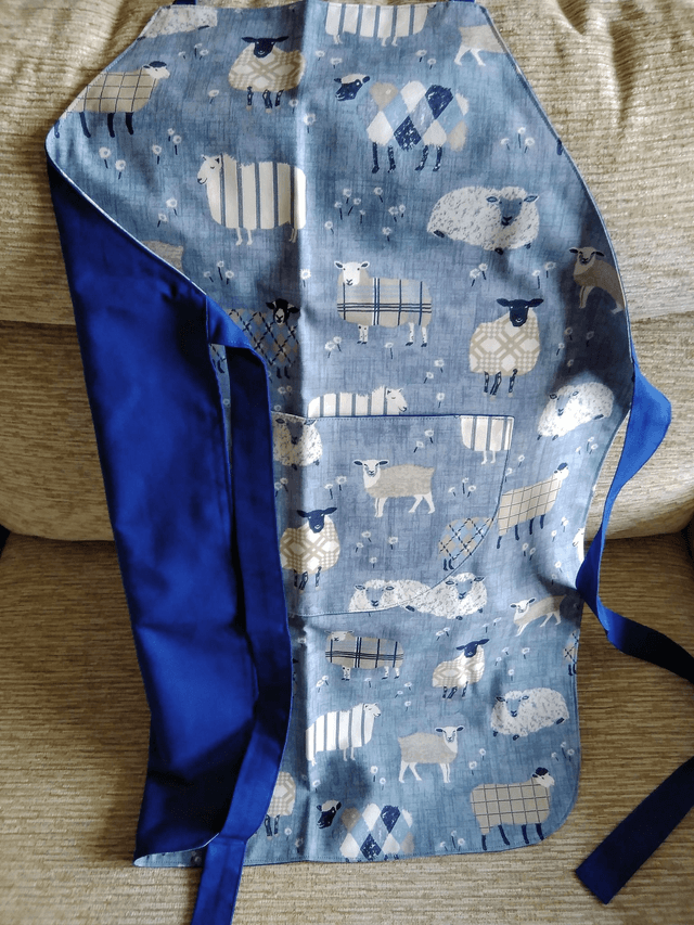 Adult Kitchen Apron Baa Baa Denim Sheep Patterned Cotton Fabric with Front pocket and Blue lining, waist ties and adjustible neck ties