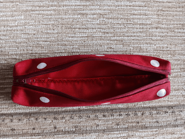 Small Box Shaped Cosmetic Bag Red background with white spots, Red Waterproof Lining, and Red Zip.