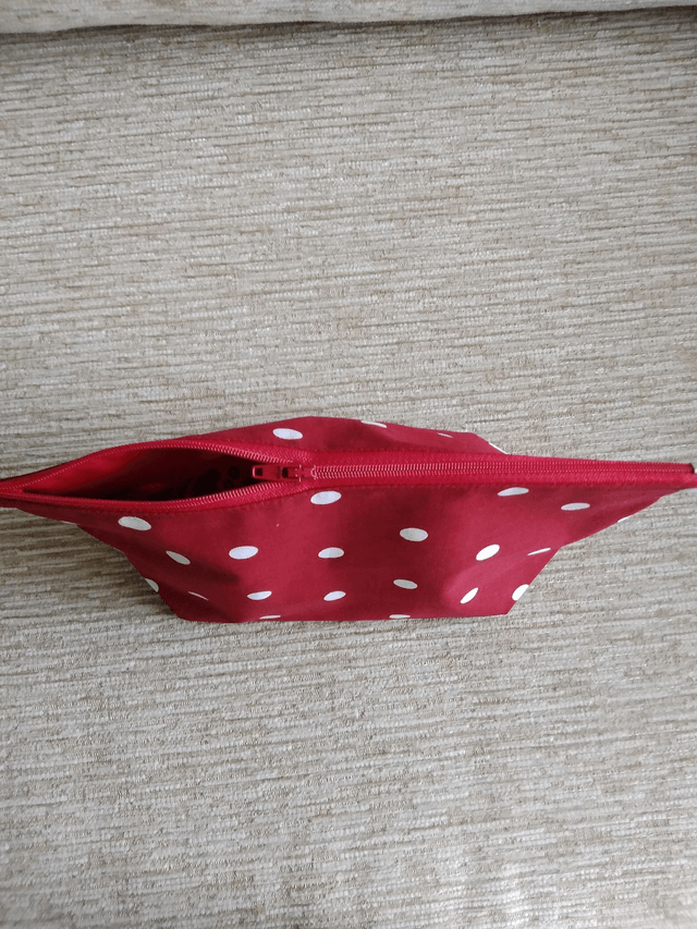 Cosmetic Toiletry Wash Bag in Red with White spots cotton fabric with red PU waterproof lining and Zip Closure.