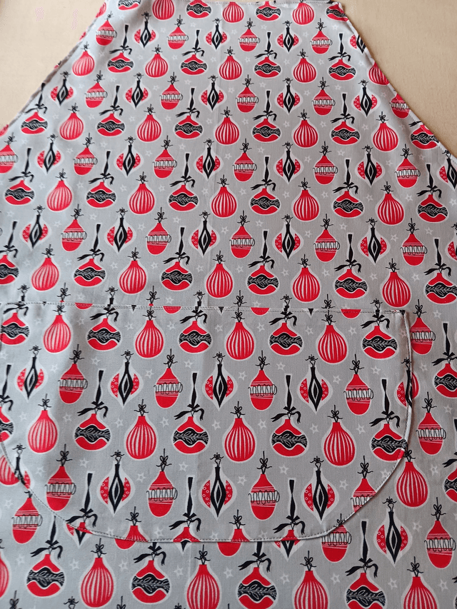 Kitchen Apron Cotton Baubles Print Fabric with Grey Lining and straps. Adjustable neck tie, lined matching pocket