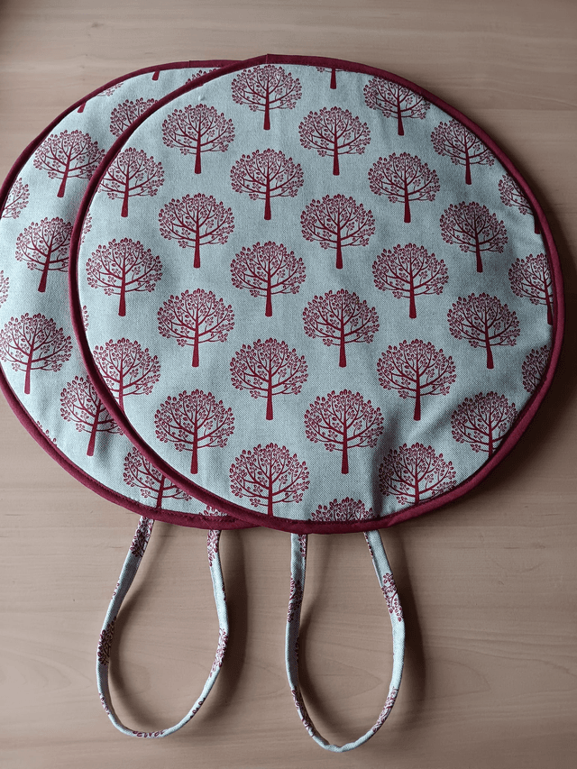 Pair of Beige Aga Lid Covers with Red Mulberry Trees Print Fabric and Burgundy binding